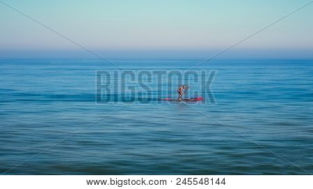 Malaga, Spain - June 02, 2018. Stand Up Paddle Board Man Paddleboarding Standing On Paddleboard On M