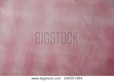 A Multicolored Decorative Abstract Blurry Background.  Grayish Red Tones