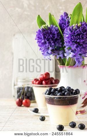 Italian Dessert Pana Cota With Berry Jam And Fresh Blueberries