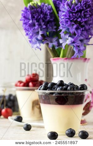 Italian Dessert Pana Cota With Berry Jam And Fresh Blueberries