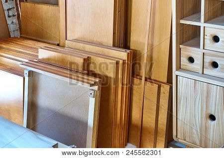 Unpacked Items On The Floor Of A New Cabinet Ready For Assembly