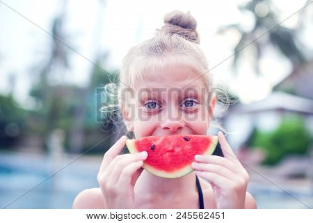 A Girl Eats A Cold Watermelon Outdoor In A Very Hot Day.concept Photo Of Hot Weather, Heat Wave, Sum