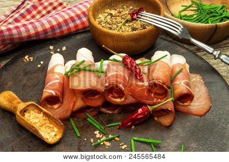 Thinly Sliced German Black Forest Ham With Sliced Ciabatta Bread. Sliced And Smoked Ham With Schwarz