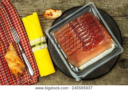 Thinly Sliced German Black Forest Ham With Sliced Ciabatta Bread. Sliced And Smoked Ham With Schwarz