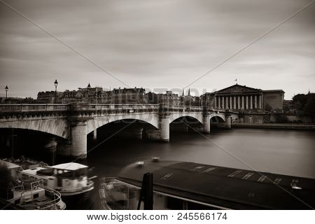 Paris River Seine with Pont de la Concorde and Assemblee Nationale at sunset