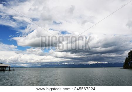 Fluffy clouds glide above Flathead Lake in Montana