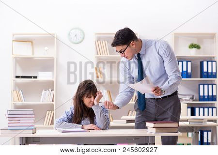 Male lecturer giving lecture to female student