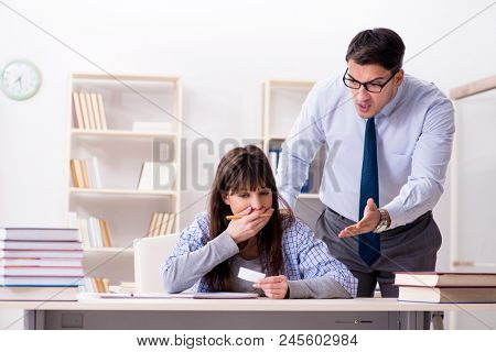 Male lecturer giving lecture to female student