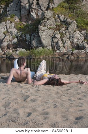 Boy And Girl On The Sand At The Mouth Of The River Rezovska On The Beach Of The Black Sea In Sinemor