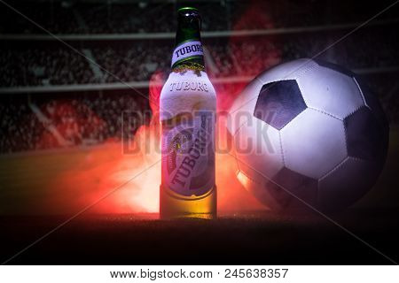 Baku,azerbaijan - June 15, 2018 : Creative Concept. Tuborg Glass Bottle Beer On Grass With Soccer Ba