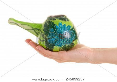 The Neti Pot In Hand On A White Background Isolation
