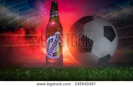 Baku,azerbaijan - June 15, 2018 : Creative Concept. Tuborg Glass Bottle Beer On Grass With Soccer Ba
