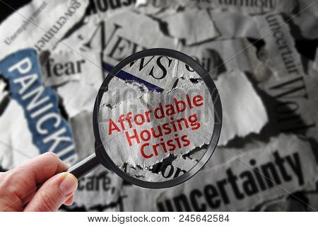 Affordable Housing Crisis Newspaper Headline And Magnifying Glass