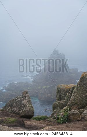 Large Boulders On The Coast Of The Lands End - The Most Westerly Point Of England Which Is A Popular