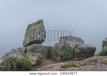 Large Boulders On The Coast Of The Lands End - The Most Westerly Point Of England Which Is A Popular