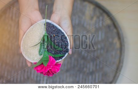 On Seletive Focus Of Young Woman Holding Heart-shaped Cup That Put Rice Berry & Flowers Pink Paste A