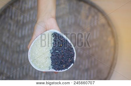 On Seletive Focus Of Young Woman Holding Heart-shaped Cup That Put Rice Berry &