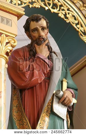 SISAK, CROATIA - DECEMBER 07: Statue of Saint Paul on the main altar in the Church of Holy Cross in Sisak, Croatia, on December 07, 2017.