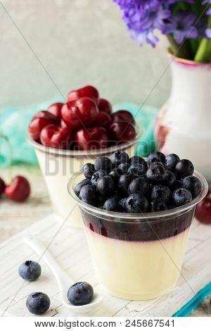 Italian Dessert Pana Cota With Berry Jam And Fresh Blueberries