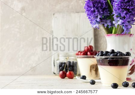 Italian Dessert Pana Cota With Berry Jam And Fresh Blueberries