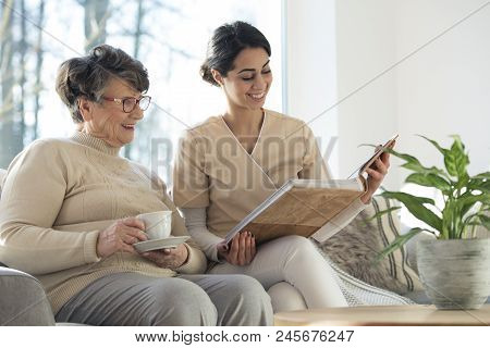 Caretaker With Elder In Room