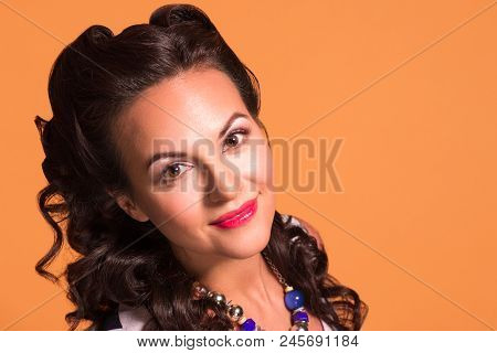 Happy Brunette With Hairdo And Make Up Poses In Studio, Pin Up Style, Close Up Portrait