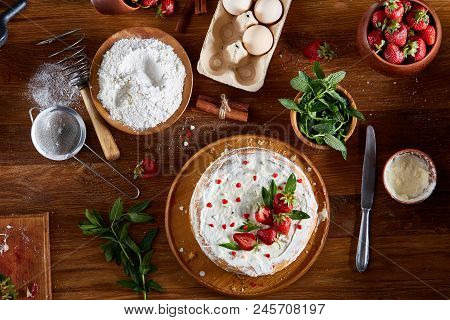 Strawberry Tart Covered With Whipped Sour Cream On A Wooden Tray Over Rustic Background, Close-up, S