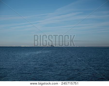 Cruise Ship Floating Away On The Waves Of The Sea.