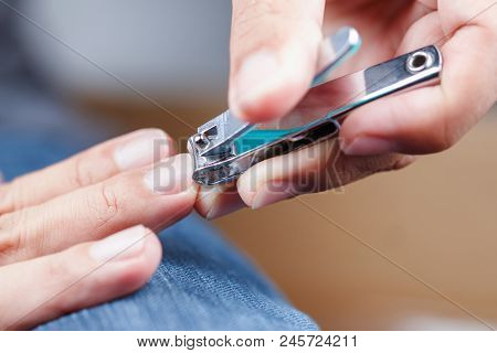 Man Cutting Nails. Health And Lifestyle Concept