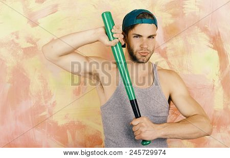 Player With Confident Face Plays Baseball. Sports And Baseball Training Concept. Guy In Grey Tank To