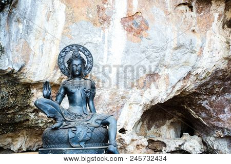 Black Buddha Statue In The Temple Area,