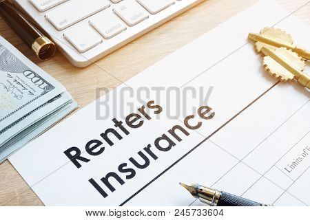 Renters Insurance Form On A Table And Keys.