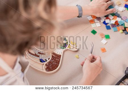 Workplace Of The Mosaic Master: Women's Hands Holding Tool For Mosaic Details In The Process Of Maki