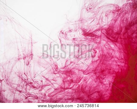Silky Cloud Of Red Acrylic Colour. Image Of Acrylic Droplet Transforming Into Silky Red Cloud In Wat