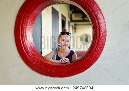 Young Tourist In Window On Jonker Street In Malacca City In Malaysia. Beautiful Chinatown In South E