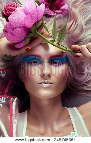 Gorgeous Woman In Biofuture Pompadour Style. Female In Fashion Transparent Raincoat With Splendid Ma