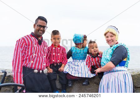 Urk, Netherlands - May 19, 2018: Unknown Family In Traditional Costumes On The Urkerdays. Urk Is On 