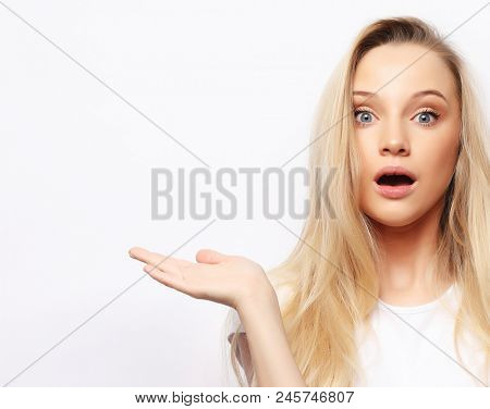 People, body language, emotions concept: Surprised terrified female gestures with uncertainty, stares at camera, puzzled as doesn`t know anwser on tricky question