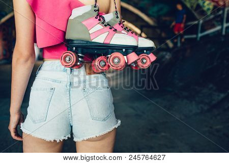 A Picture Of Attractive And Hot Body Of Girl Standing And Holding Rollers With Right Hand. Her Body 