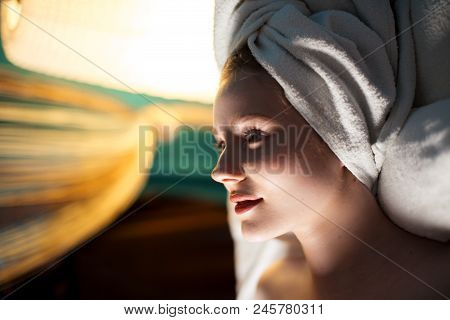 Cute Girl With Perfect Skin Abd Towel On Head Preparing To Face Lifting Massage, Skin Treatment, Ski