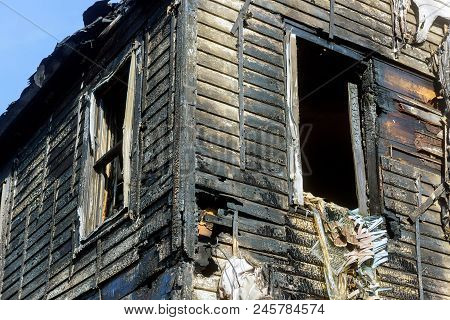Dramatic Landscape After Fire Fiery Destruction To A House. Useful Image For Any Fire Prevention The