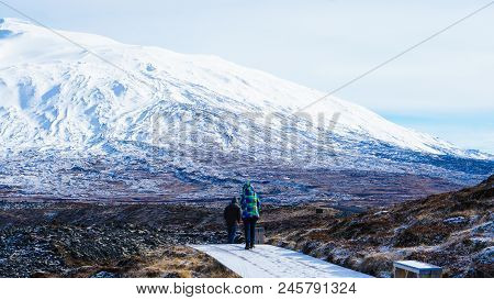 Tourist Walk In Iceland Volcanic Landscape Moutnian Background