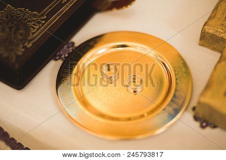 Two Golden Wedding Rings Isolated Background Concept.