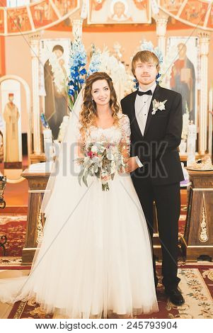 Wedding Couple Bide And Groom Get Married In A Church.