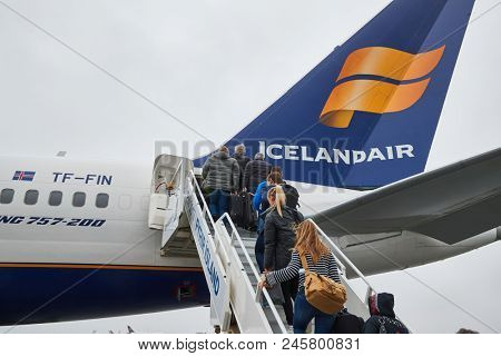KEFLAVIK, ICELAND - MAY 8, 2018: Icelandair Boeing 757 aircraft boarding passangers through the back door
