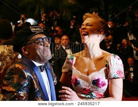  Spike Lee and Tonya Lewis Lee depart the screening of 'BlacKkKlansman' during the 71st annual Cannes Film Festival at Palais des Festivals on May 14, 2018 in Cannes, France. 