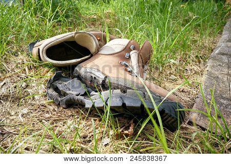 Broken Hiking Boots On A Hiking Trail In The Harz National Park In Germany