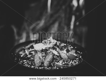 Restaurant Dish Concept. Dish Of Beef Or Veal Served With Lettuce Leaves, Tomatoes And Sprinkled Wit