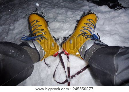 A Climber With Yellow Boots With Crampons On The Imja Tse, Island Peak, Everest Base Camp Trek, Nepa