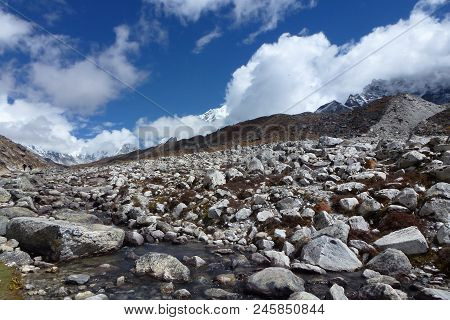 Trail In The Lobuche Valley With Big Clouds And Blue Sky, Everest Base Camp Trek, Nepal